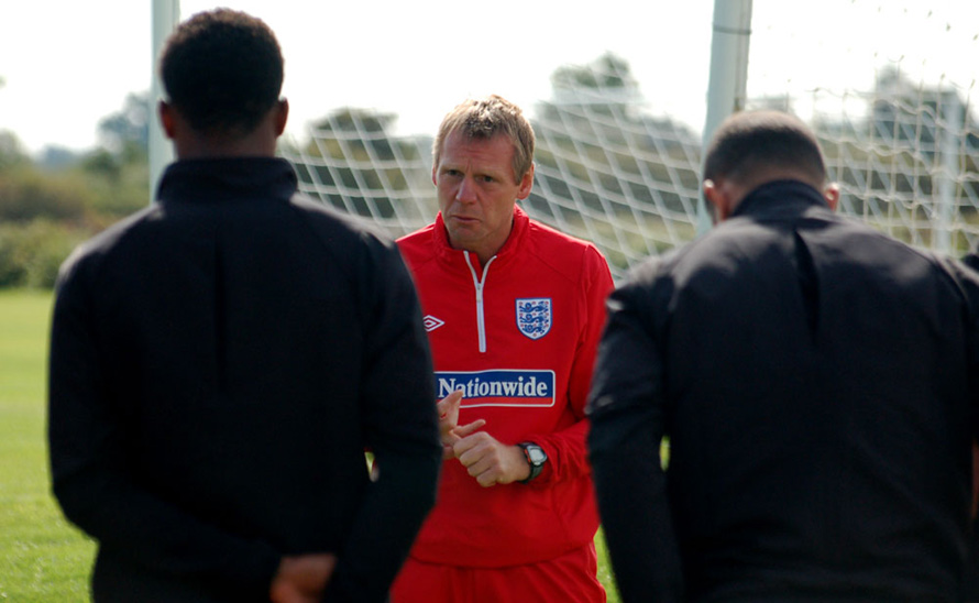Stuart Pearce talks to his players during training.